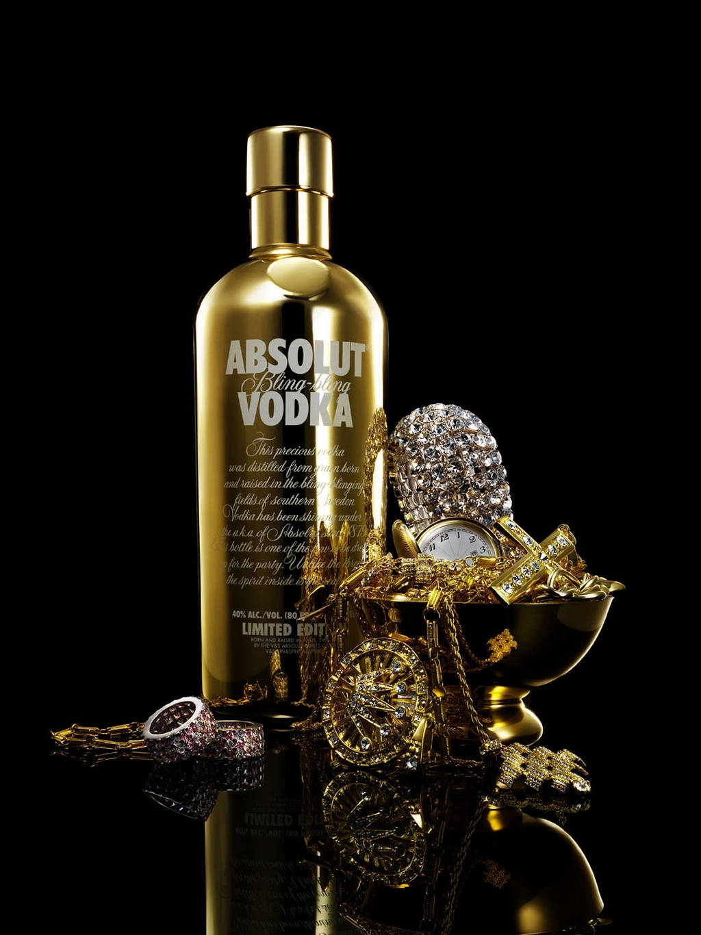 Absolut Bling Blong Vodka With Gold Jewelries Background