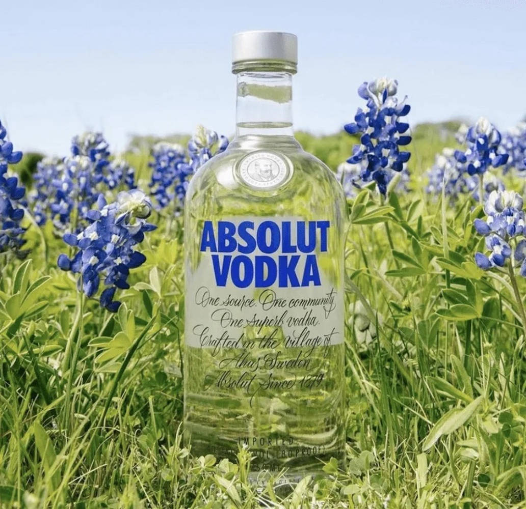 Absolut Vodka With Bluebonnet Flowers Background