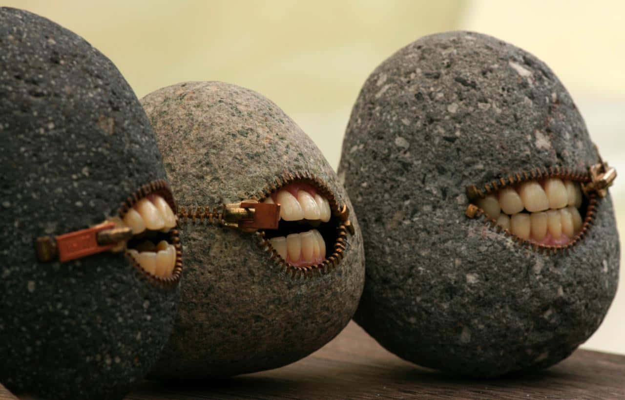 Absurd Rocks With Mouths Background