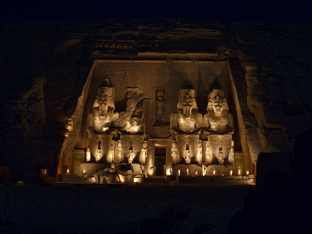 Abu Simbel's Great Ramses Statues At Night Background