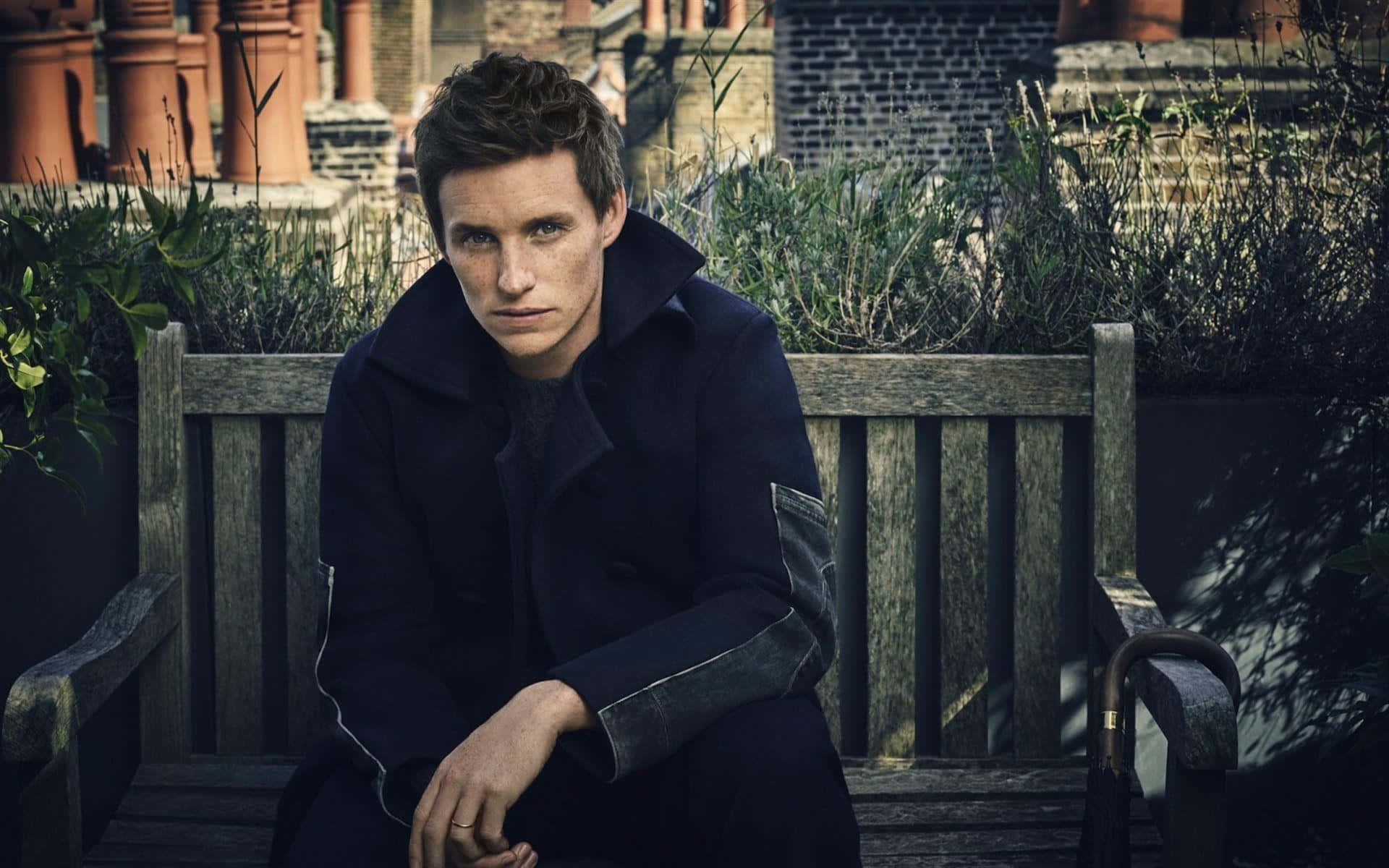 Academy Award Winner Eddie Redmayne In A Thoughtful Pose Background