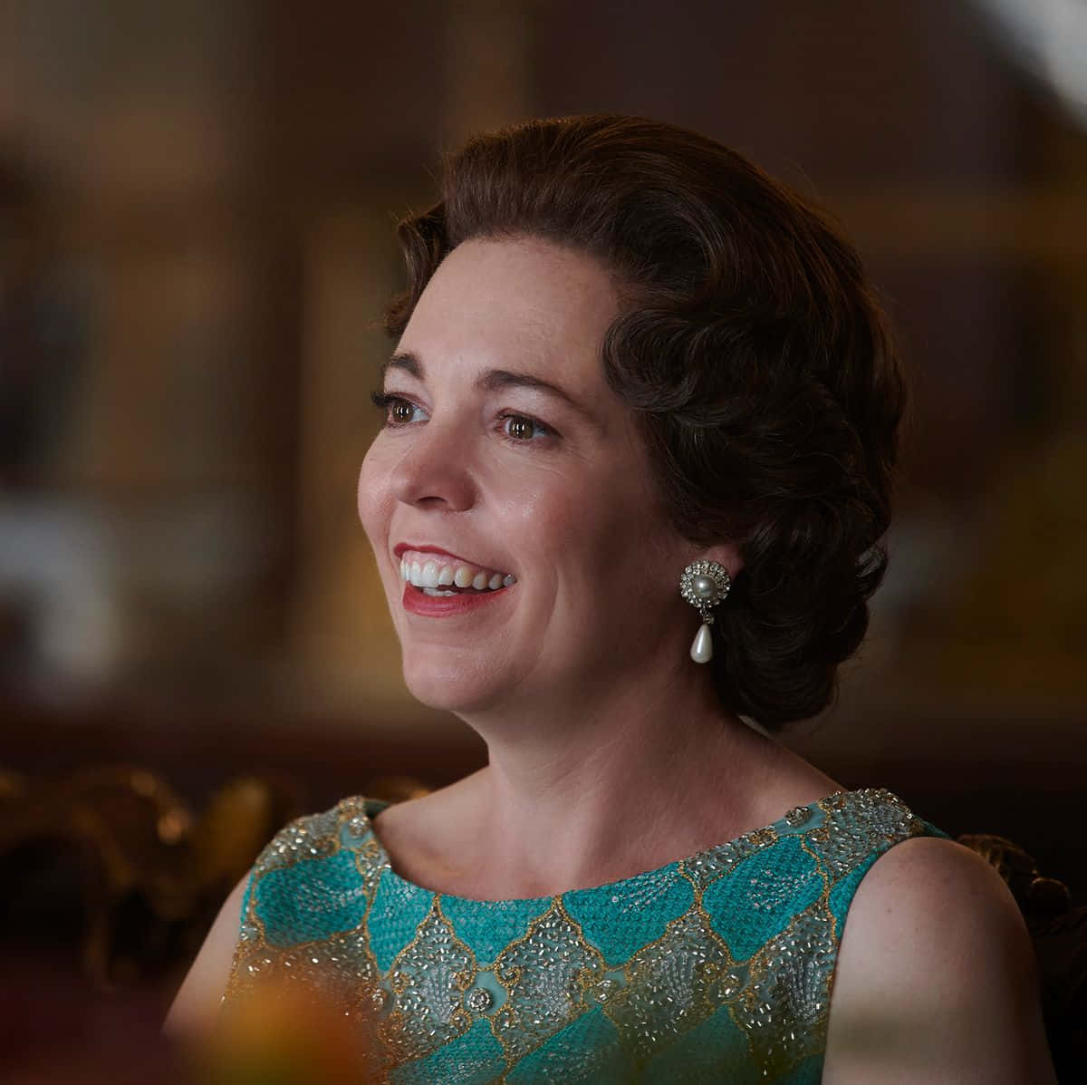 Academy Award Winner Olivia Colman Posing At The Red Carpet Event. Background