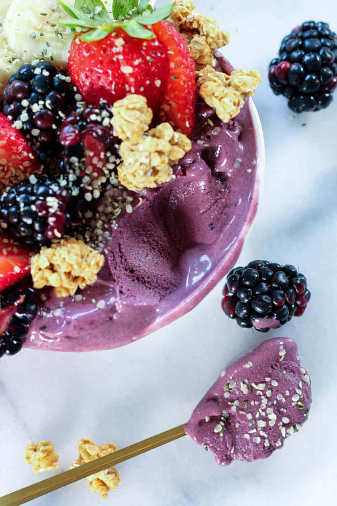 Acai Bowl With Fresh Berries And Granola Background