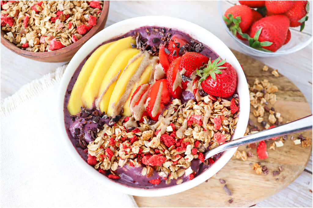 Acai Bowl With Fresh Fruits And Granola Background