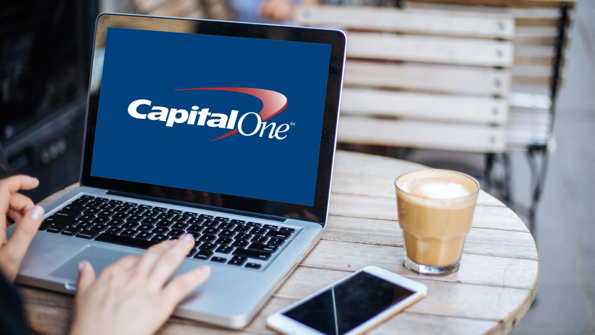 Accessing Capital One Services Via Laptop Background