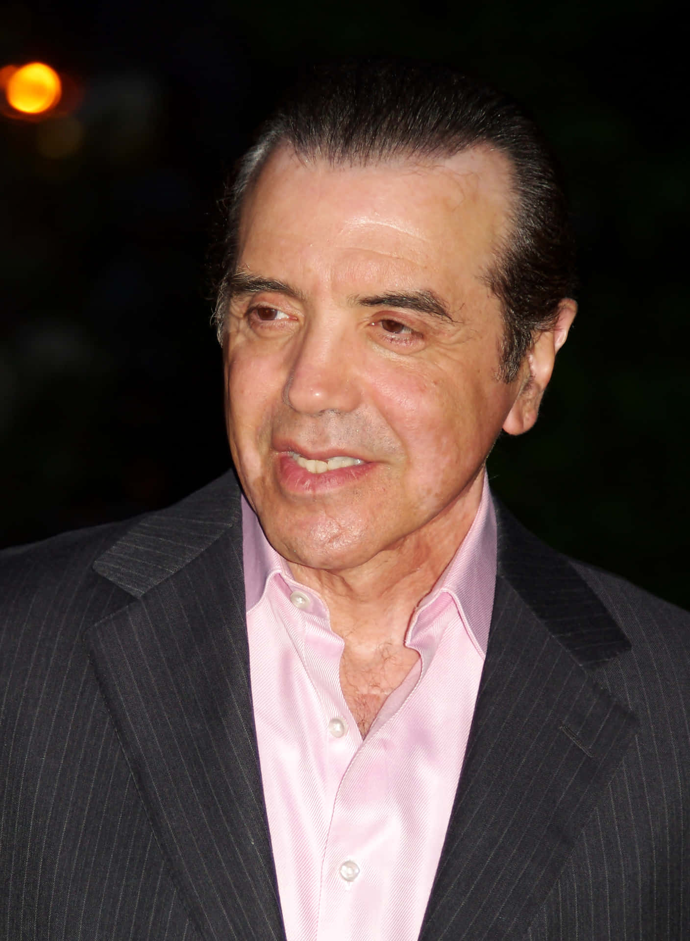 Acclaimed Actor Chazz Palminteri In Classic Black Suit Background