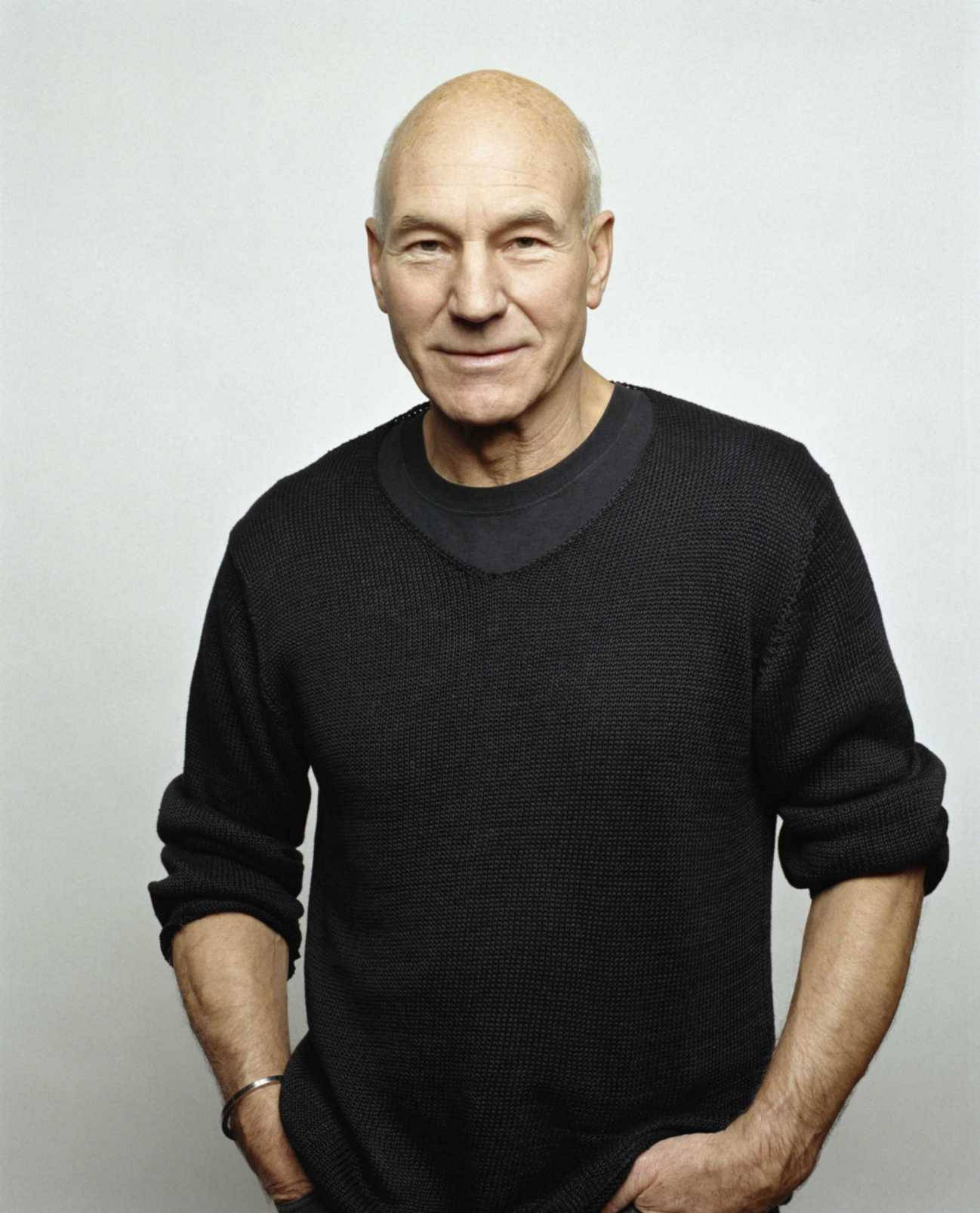 Acclaimed Actor Patrick Stewart Sporting A Classic Black Knitted Sweater Background