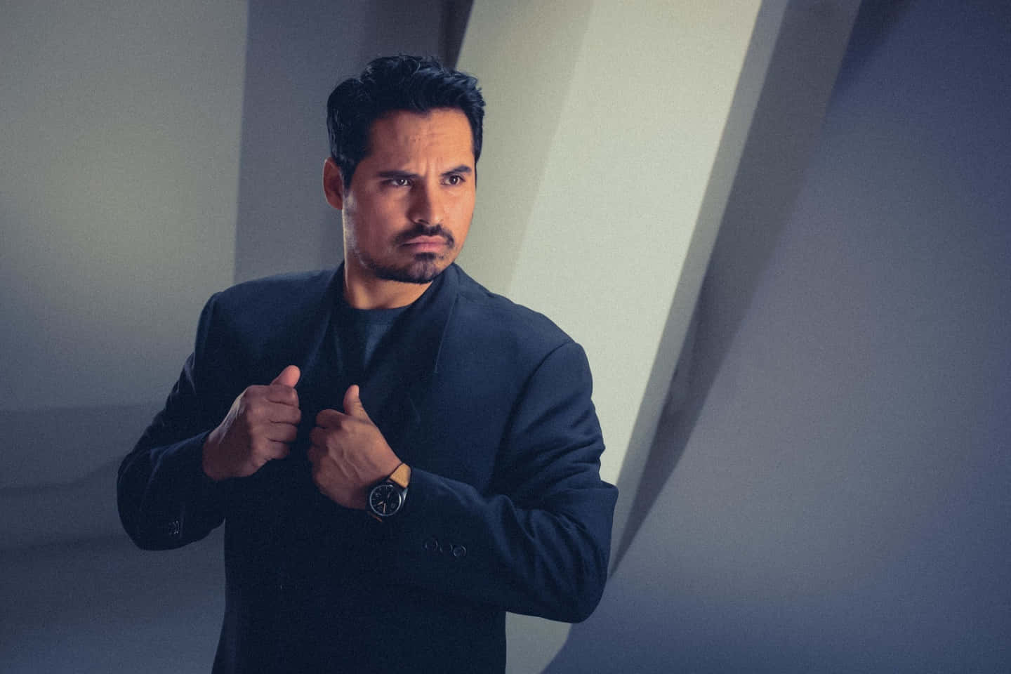 Accomplished Actor Michael Peña In Pensive Mood Background