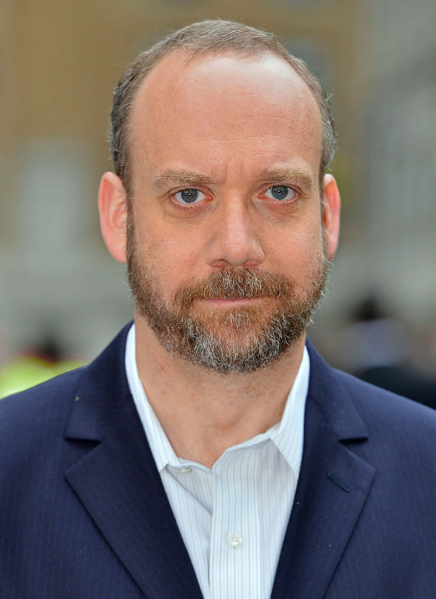 Accomplished Actor Paul Giamatti In Thoughtful Moment Background