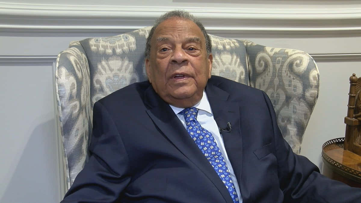 Accomplished Politician Andrew Young Discussing Important Topics During Interview Background