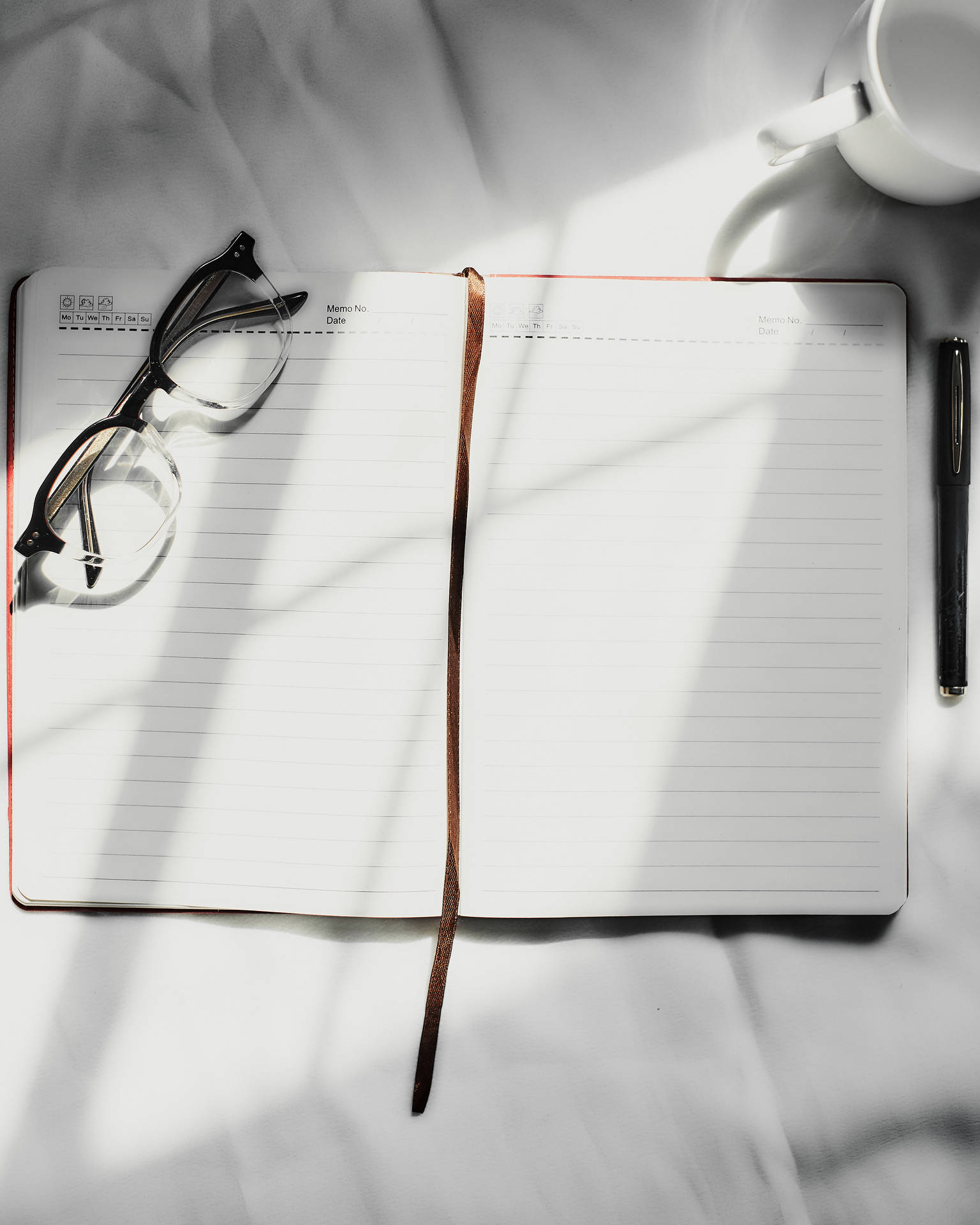 Accounting Notebook With Eyeglasses Background