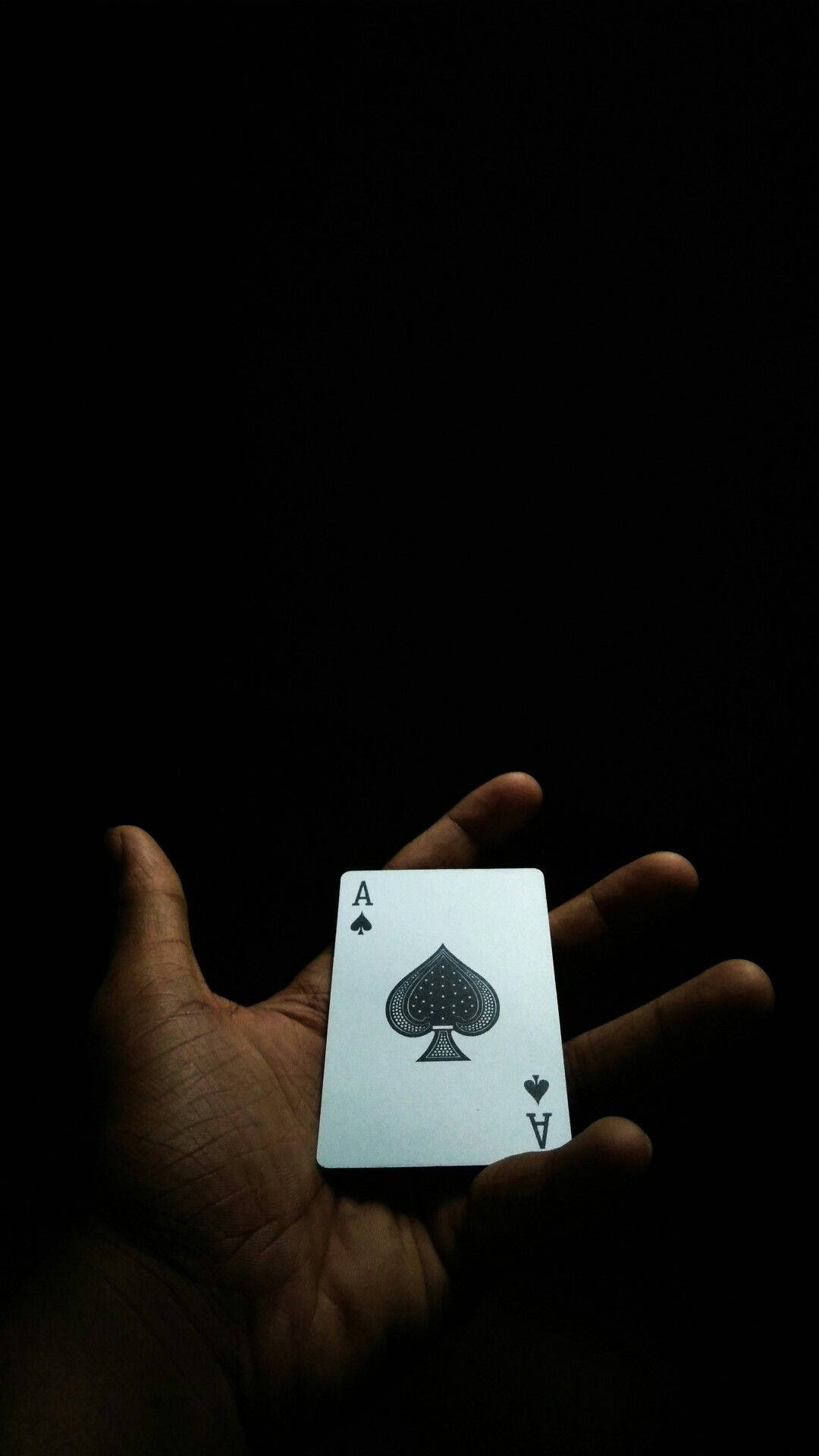 Ace Card On Hand Dark Mobile Background