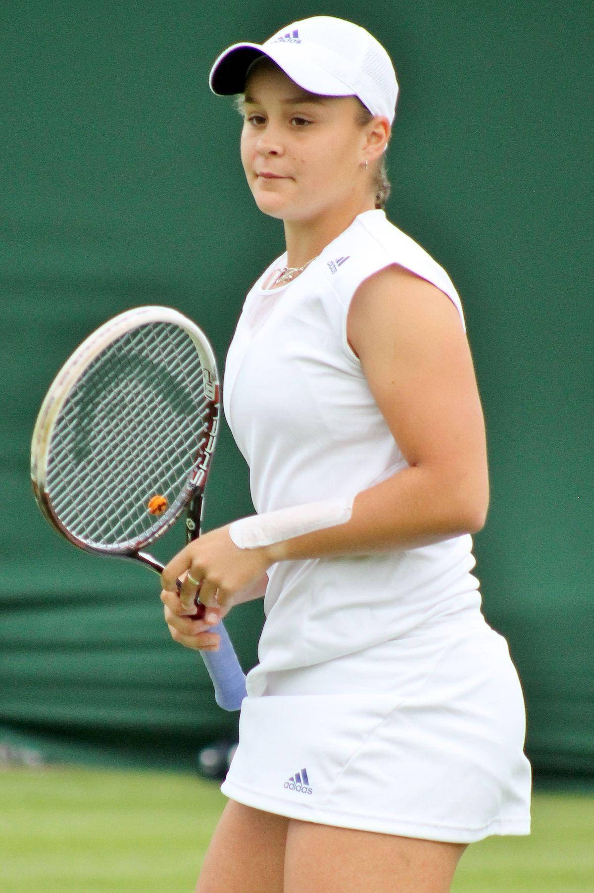 Ace Girl: Ashleigh Barty In Elegant All-white Tennis Gear Background