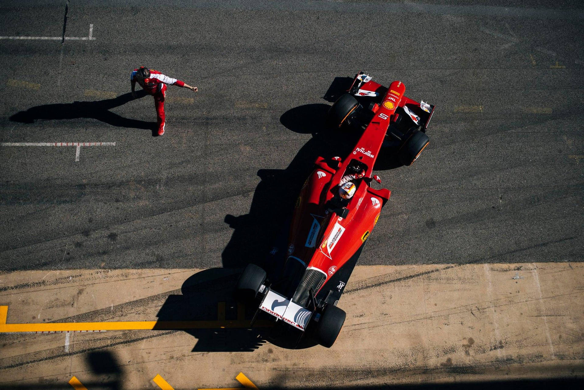 Ace Racing Champion Sebastian Vettel From A Bird's Eye View Background