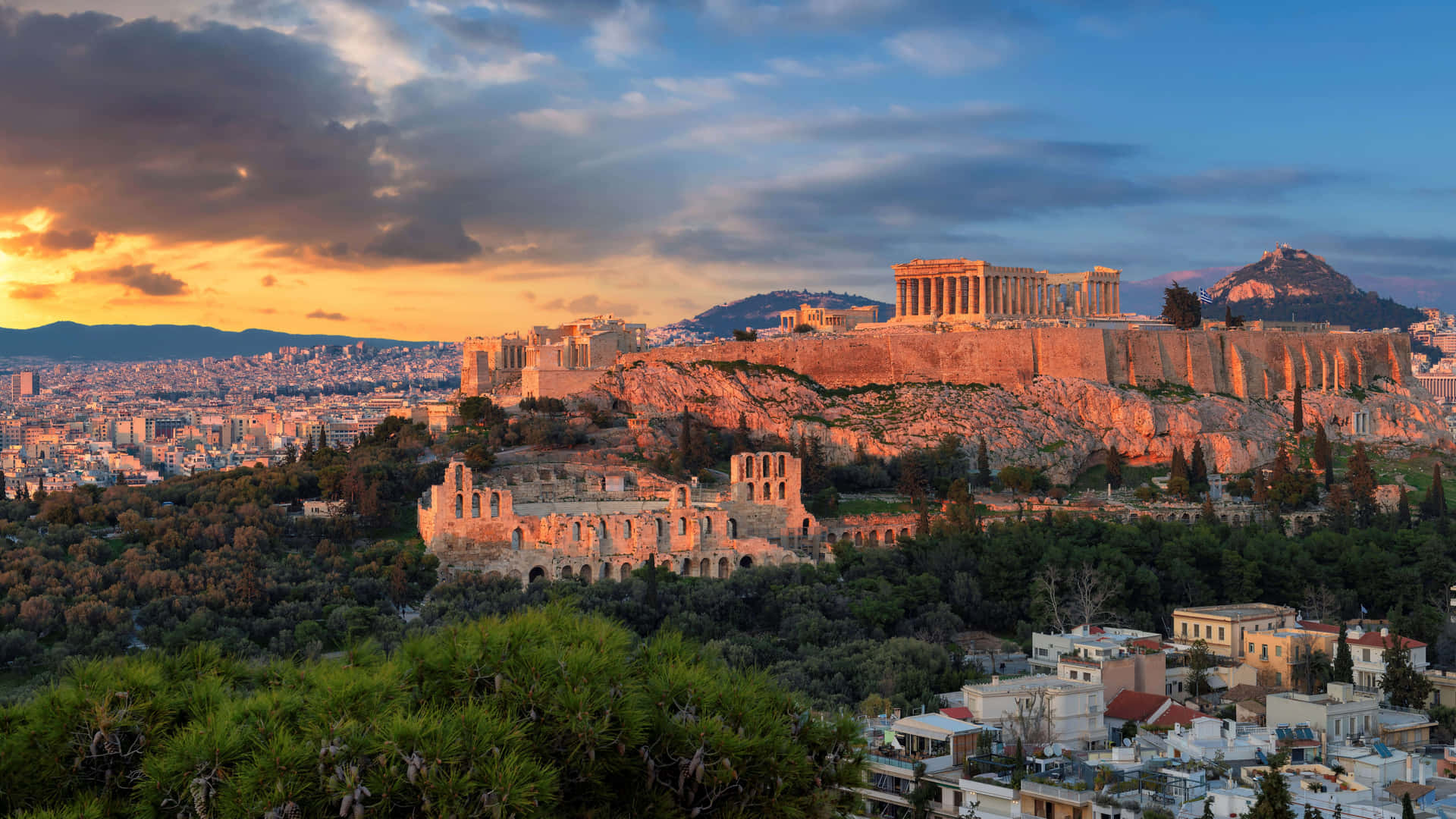 Acropolis Surrounded By Trees At The Base Background