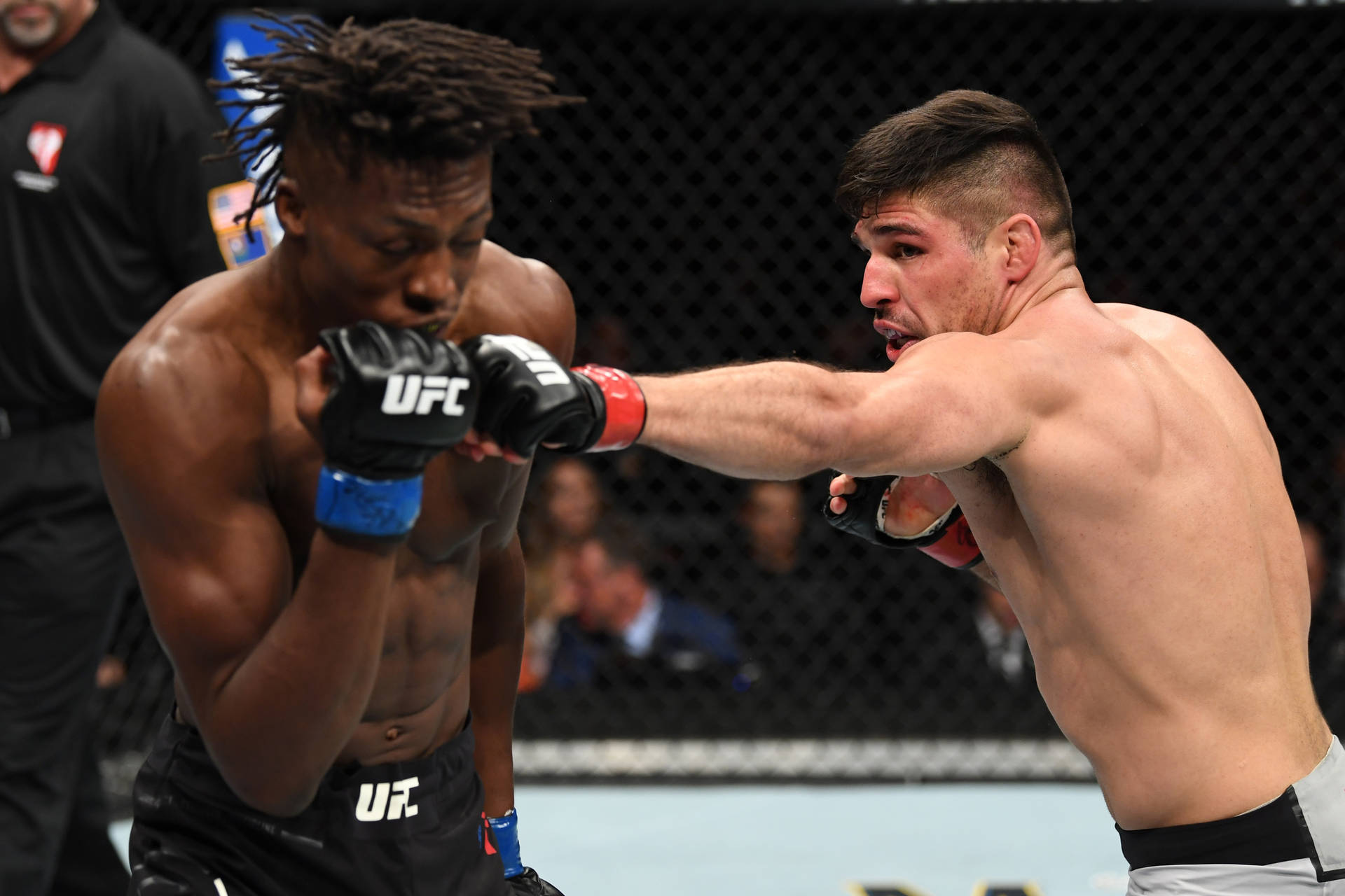 Action-packed Fight Between Vicente Luque And Jalin Turner Background