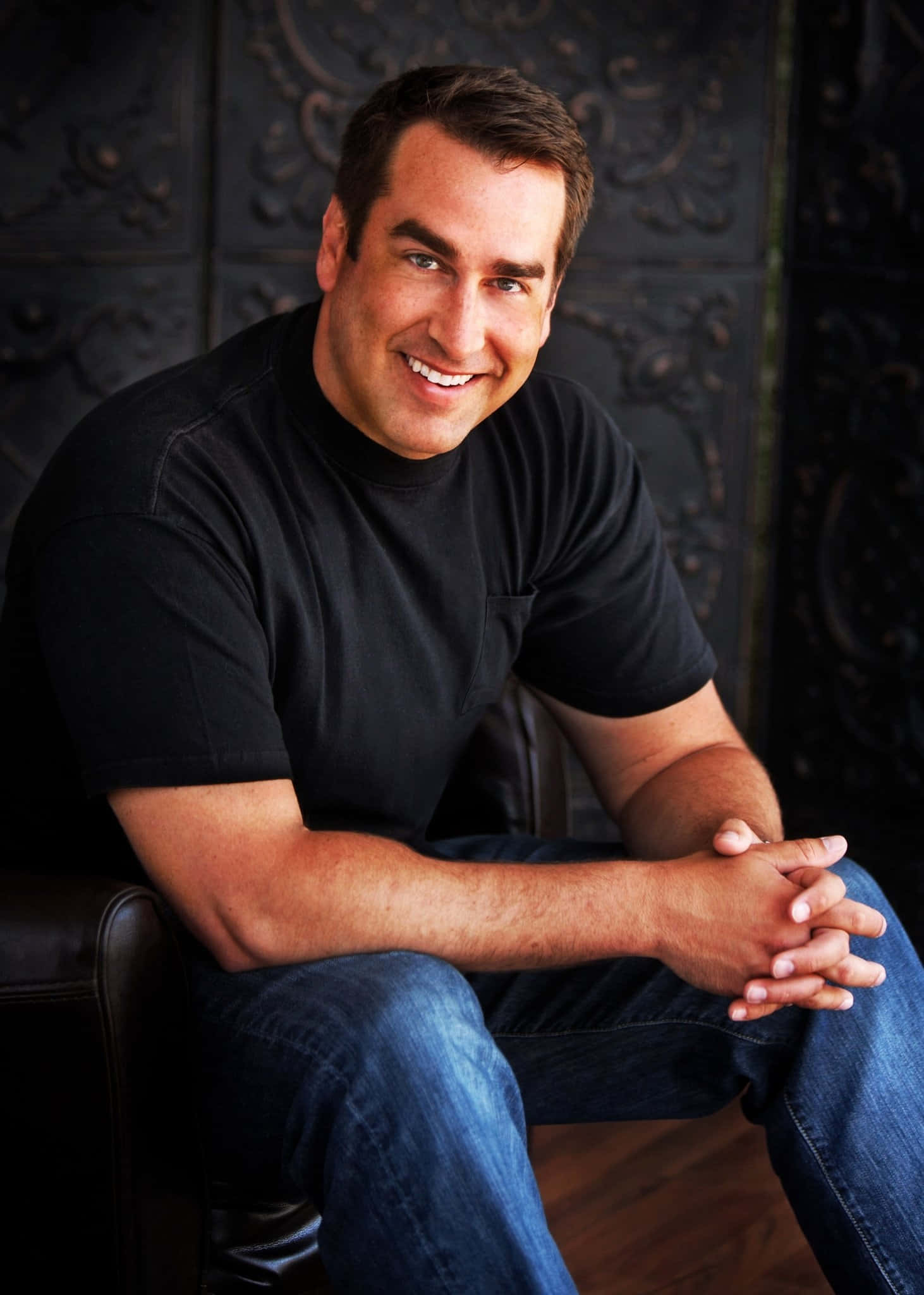 Actor And Comedian Rob Riggle Spreading Laughter Background