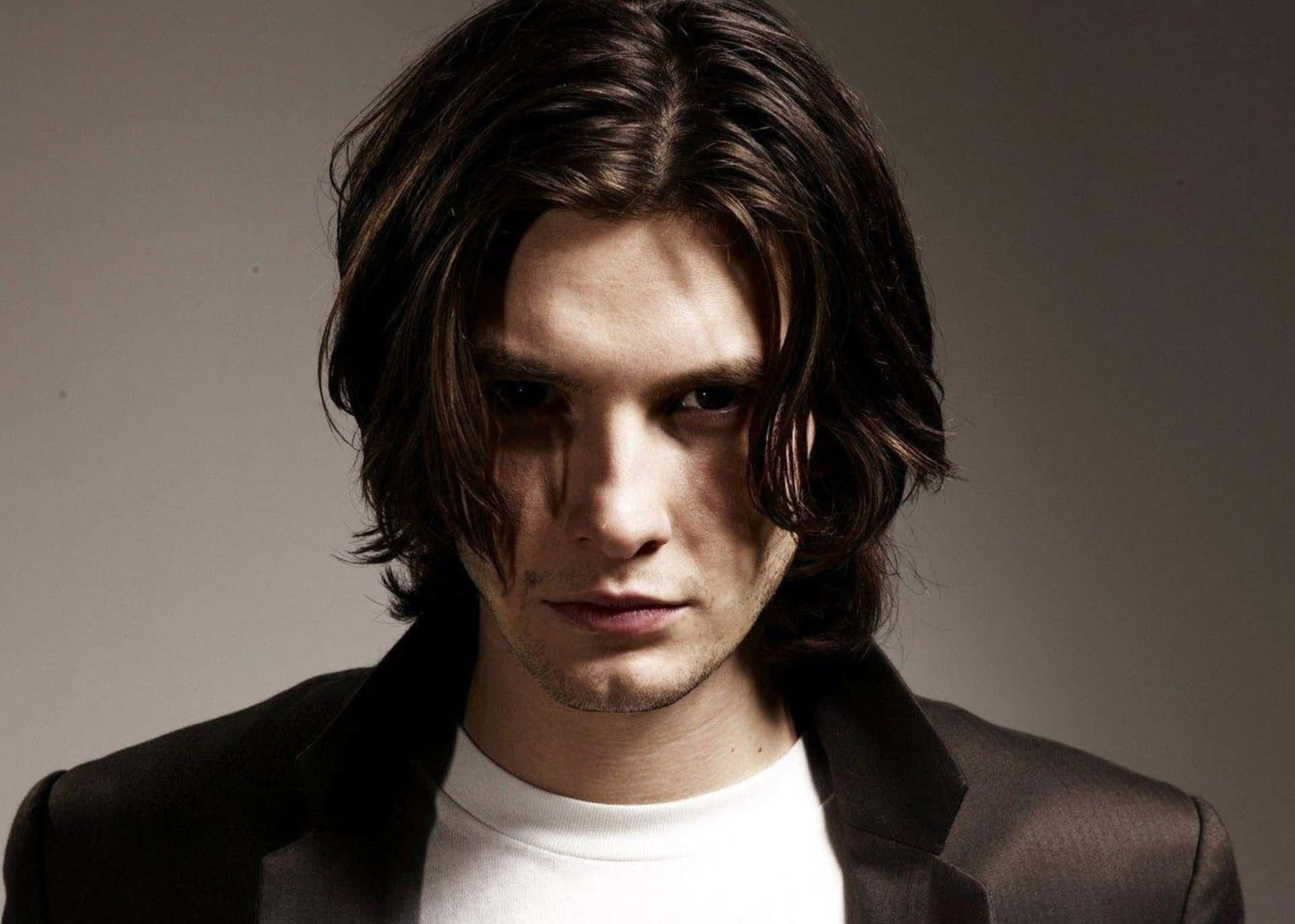Actor Ben Barnes Posing In A Stylish Suit Background