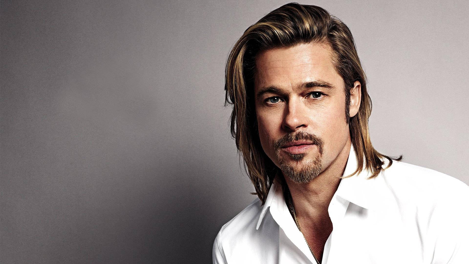 Actor Brad Pitt Mixes Casual Chic With Long Hair And Beard Background
