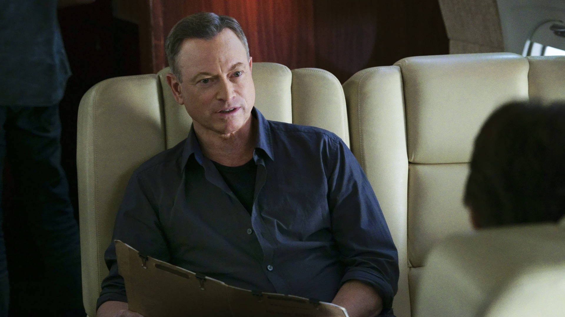 Actor Gary Sinise Inside An Airplane Background