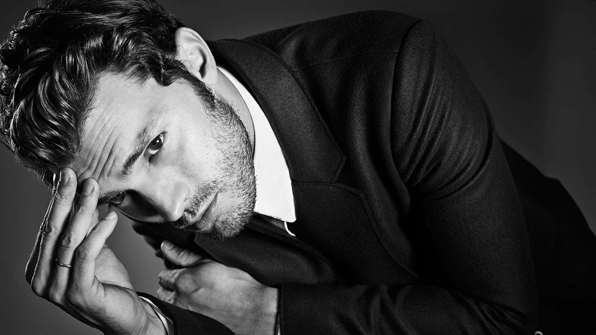 Actor Jamie Dornan In A Thoughtful Pose Background