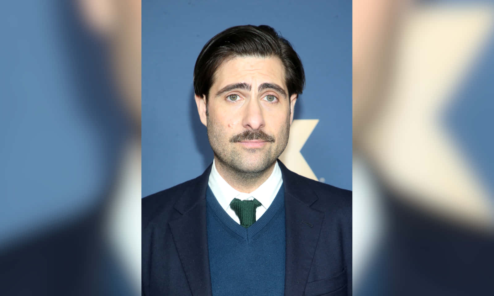 Actor Jason Schwartzman In A Candid Shot Background