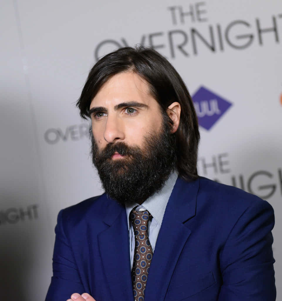 Actor Jason Schwartzman Poses For A Photo On The Red Carpet Background