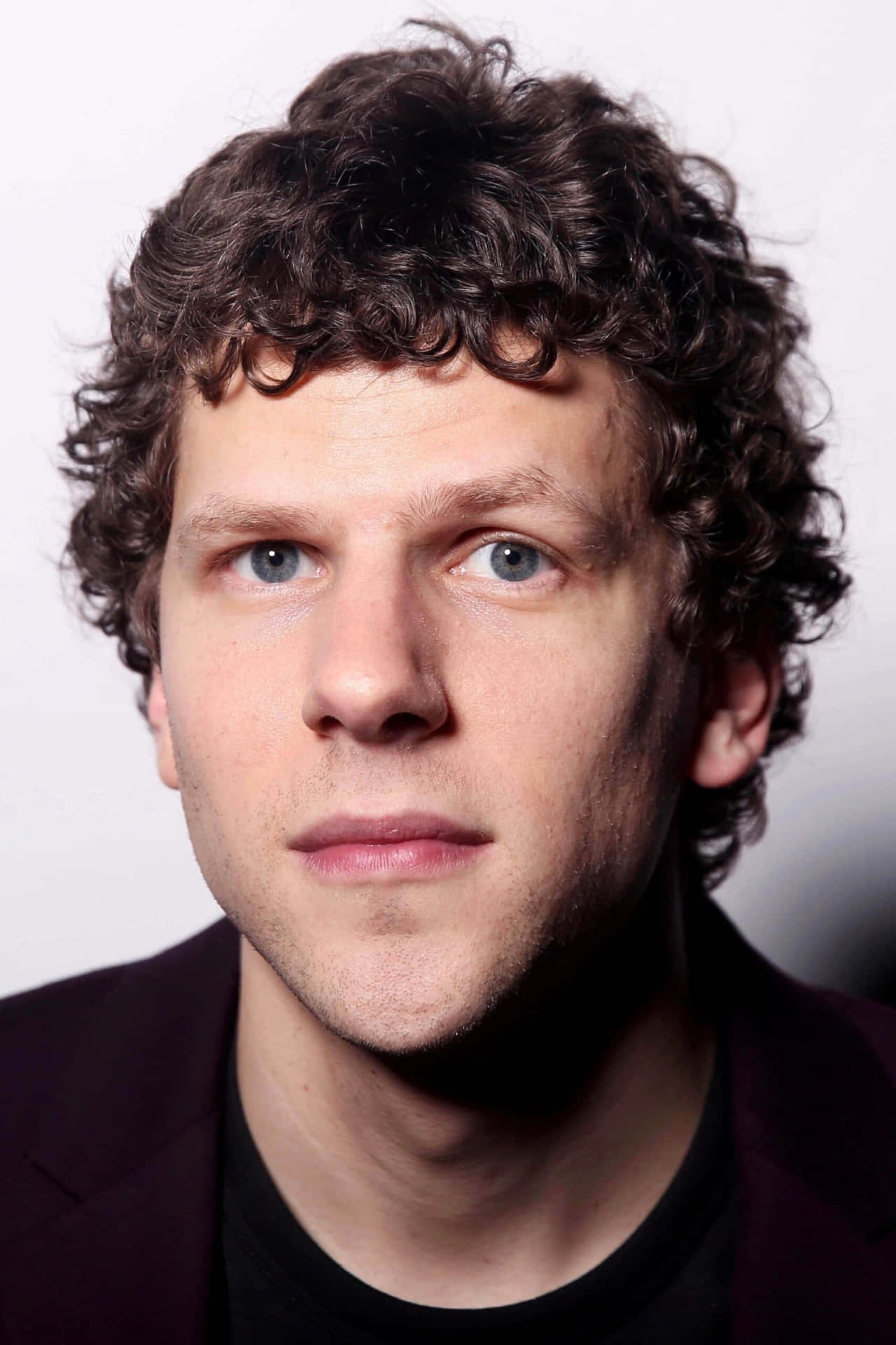 Actor Jesse Eisenberg Poses For A Publicity Shot Background