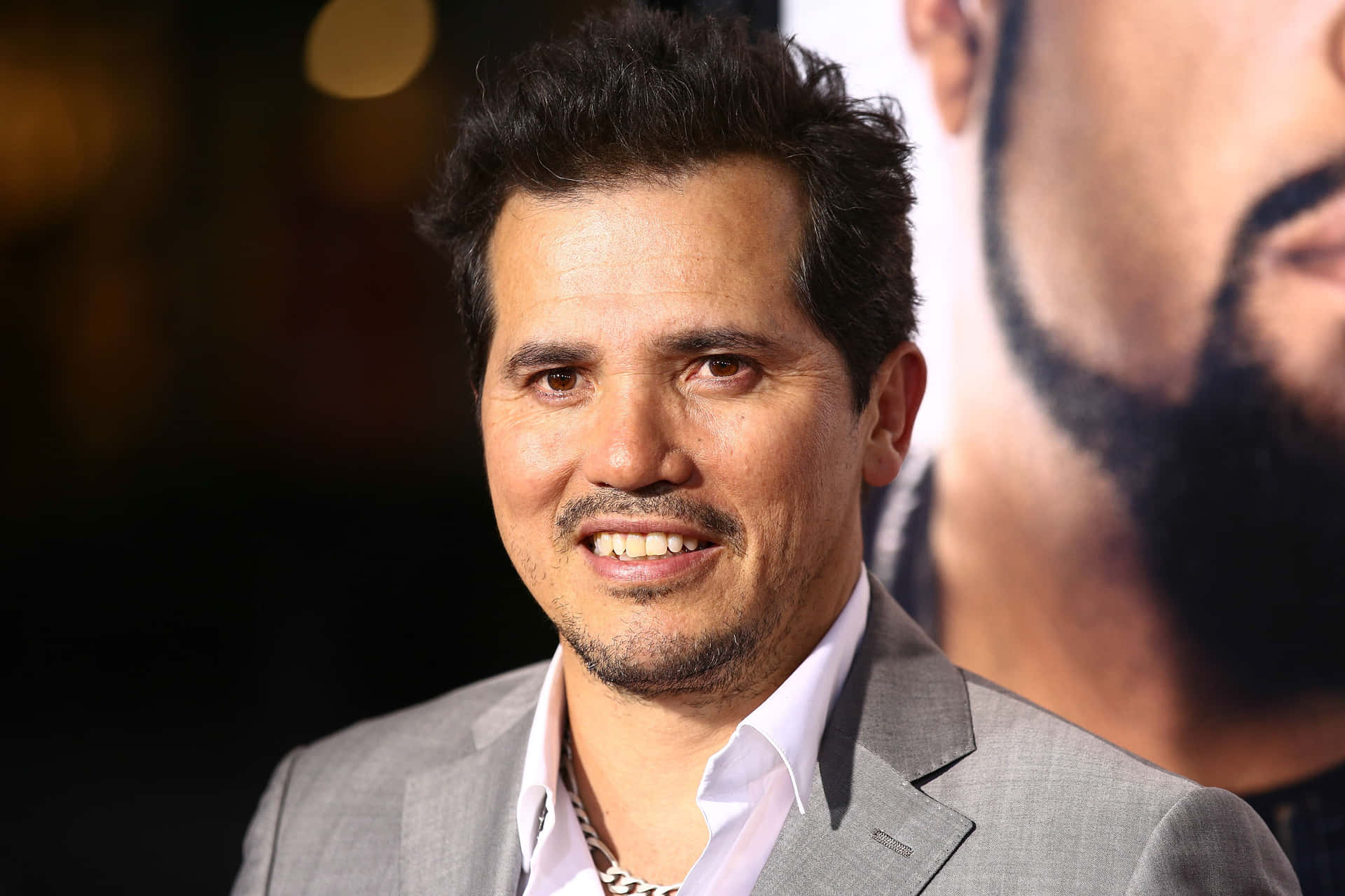 Actor John Leguizamo Looks Focused And Serious Background