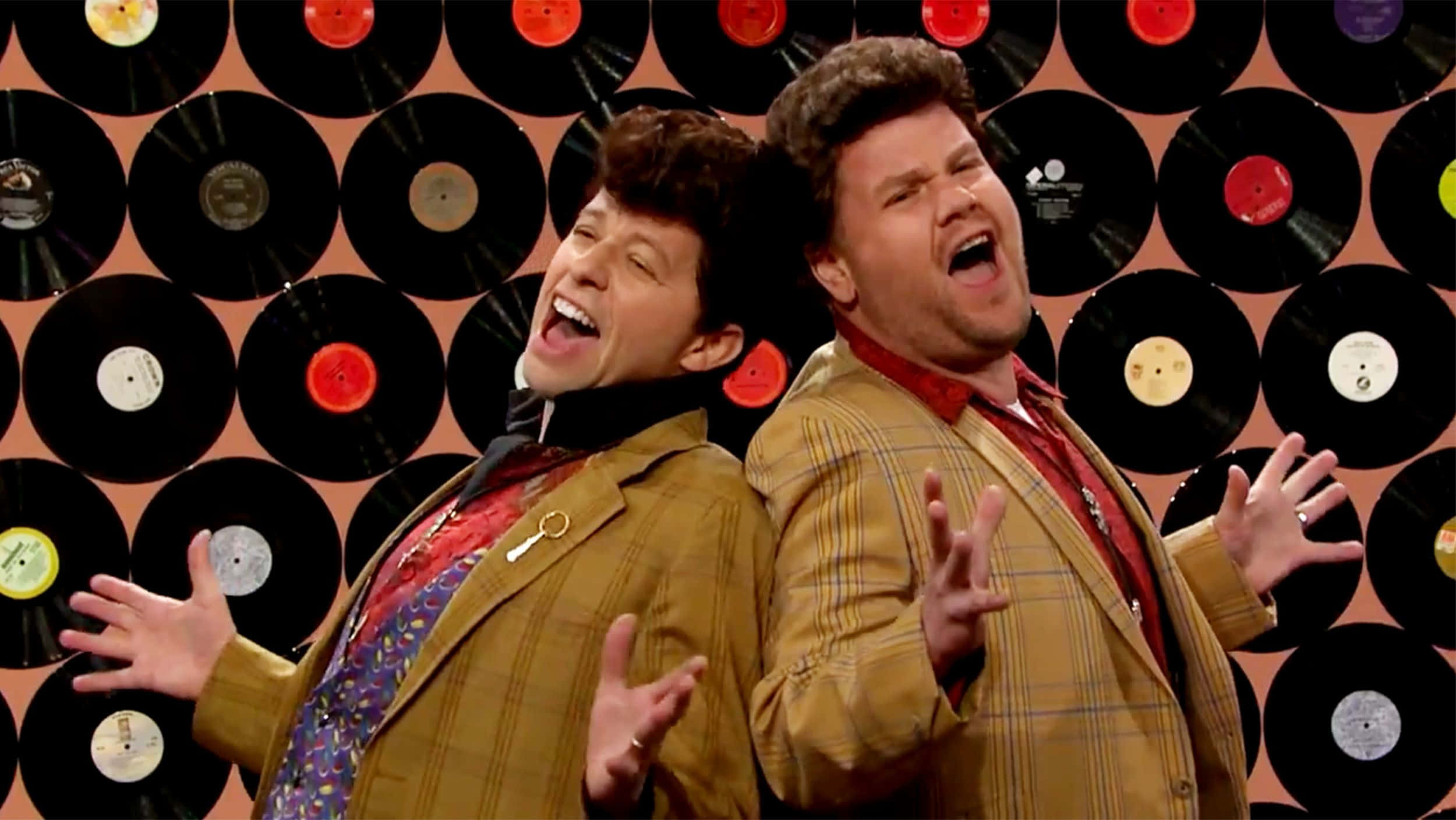 Actor Jon Cryer Smiling In A Blue Suit Background