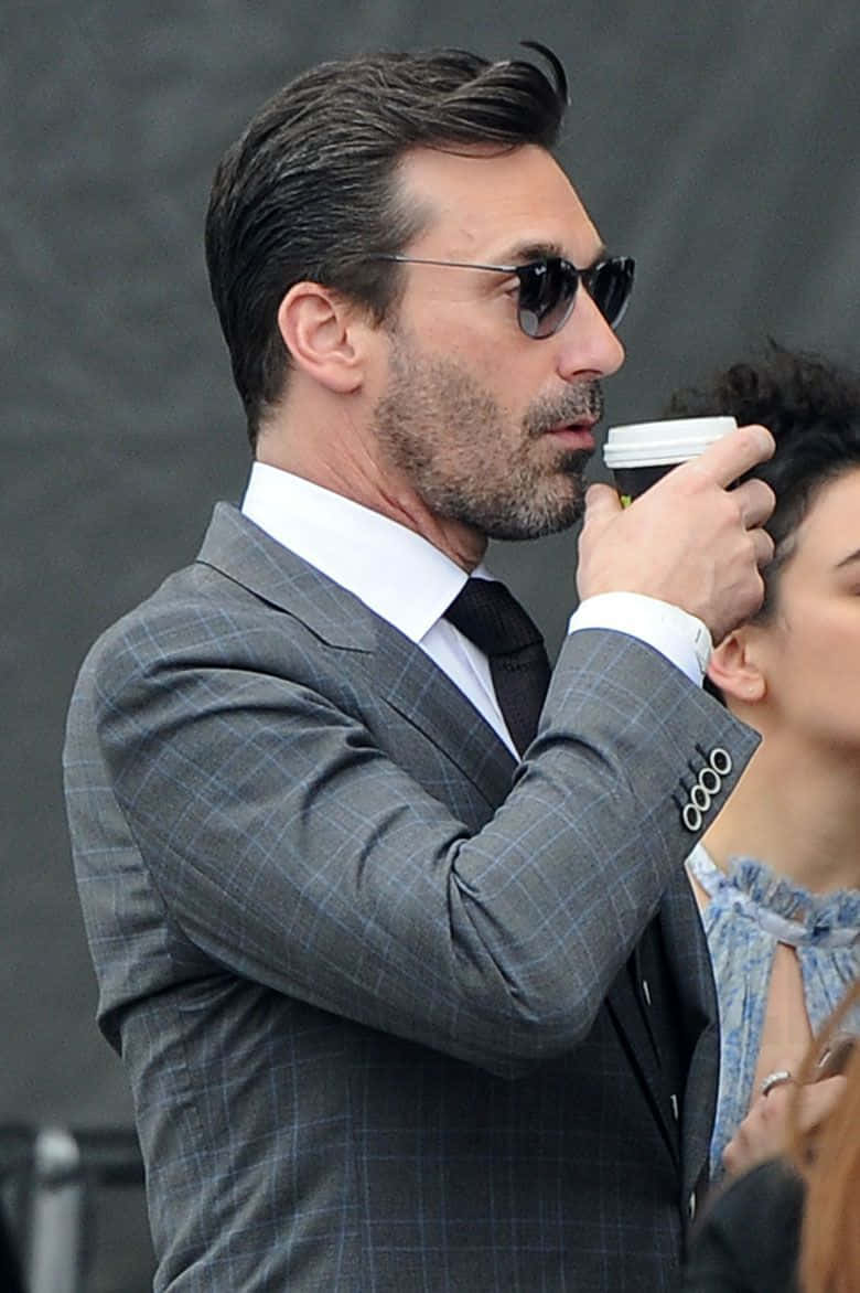 Actor Jon Hamm In A Dress Shirt And Glasse Background