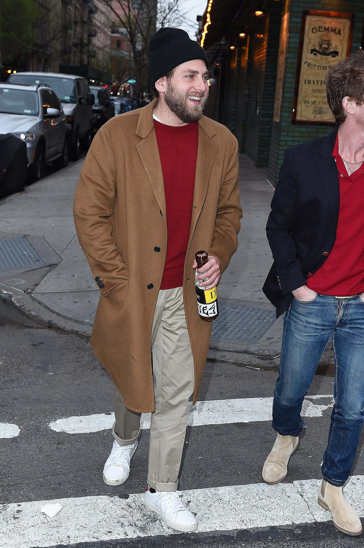 Actor Jonah Hill Looking Cool While Wearing A Cap And Sunglasses.