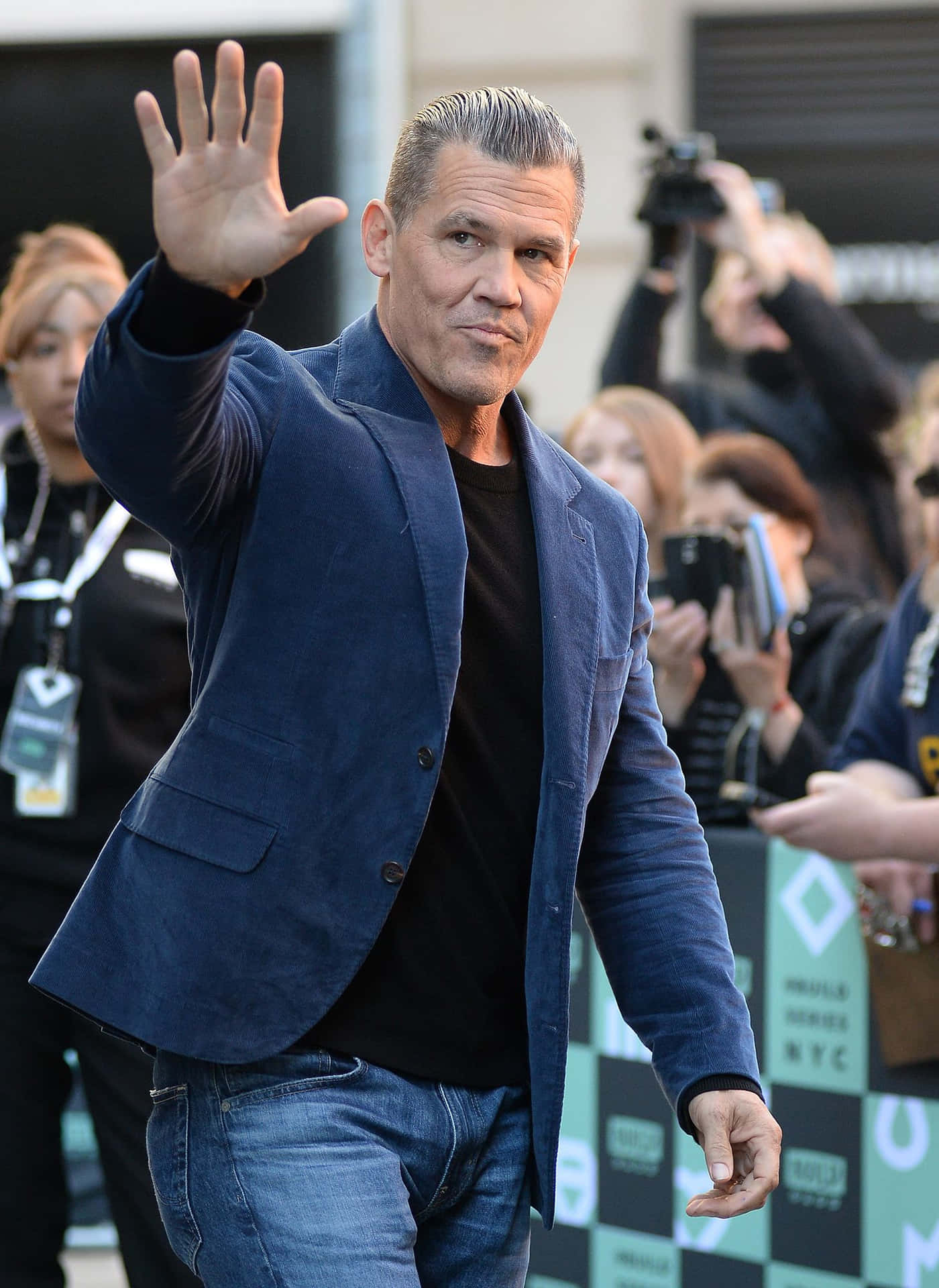 Actor Josh Brolin Looks Out Over The City Background