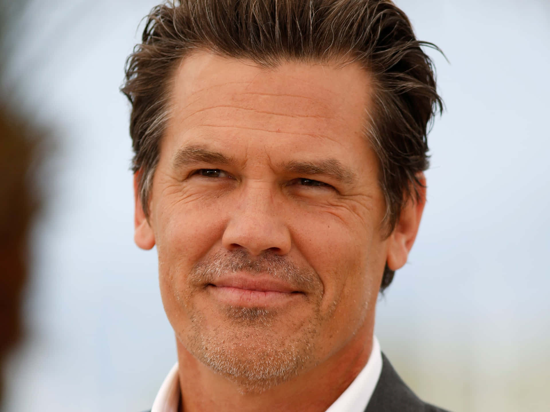 Actor Josh Brolin Striking A Dramatic Pose Background
