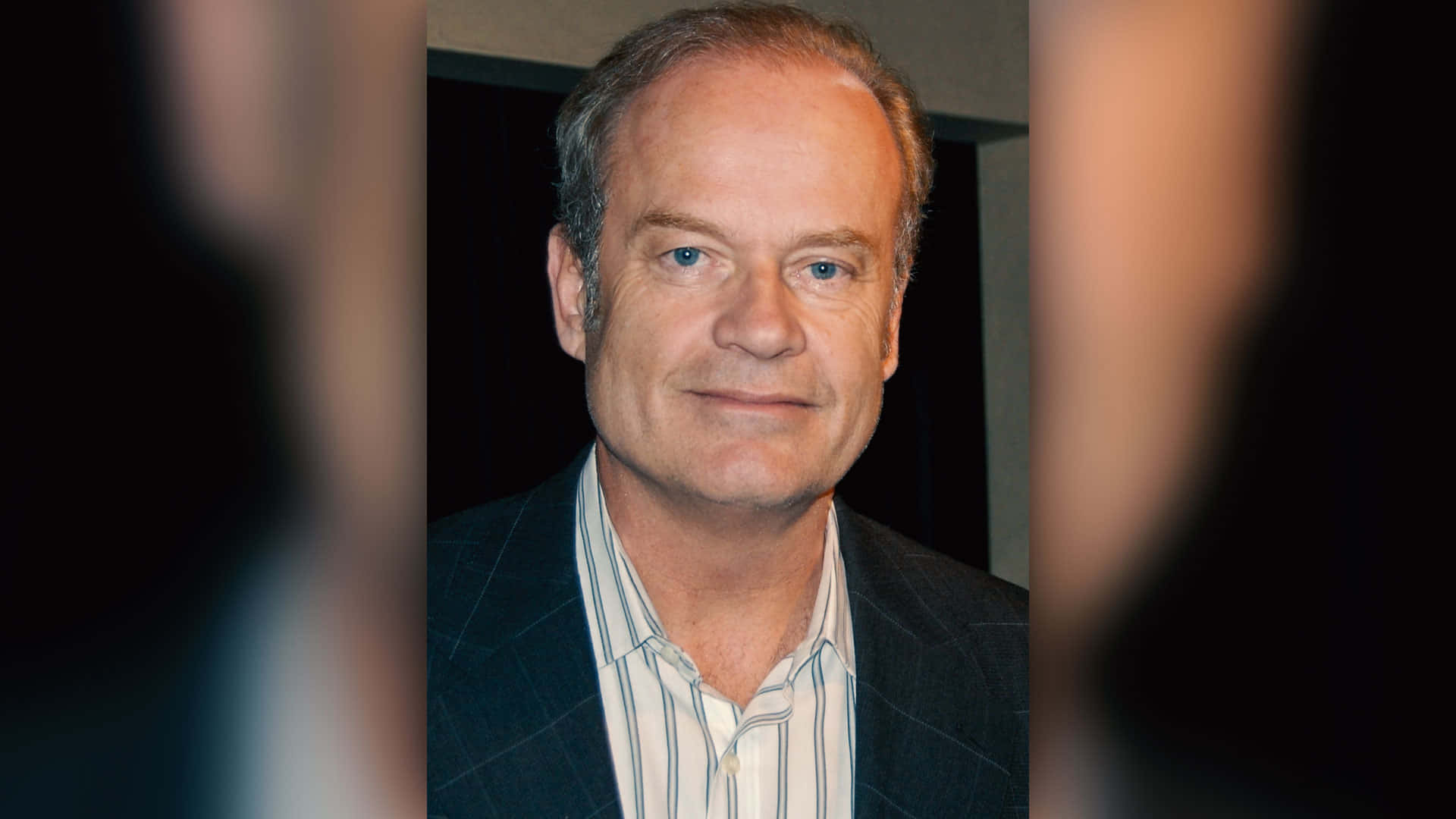 Actor Kelsey Grammer Relaxing On A Beach Chair Background