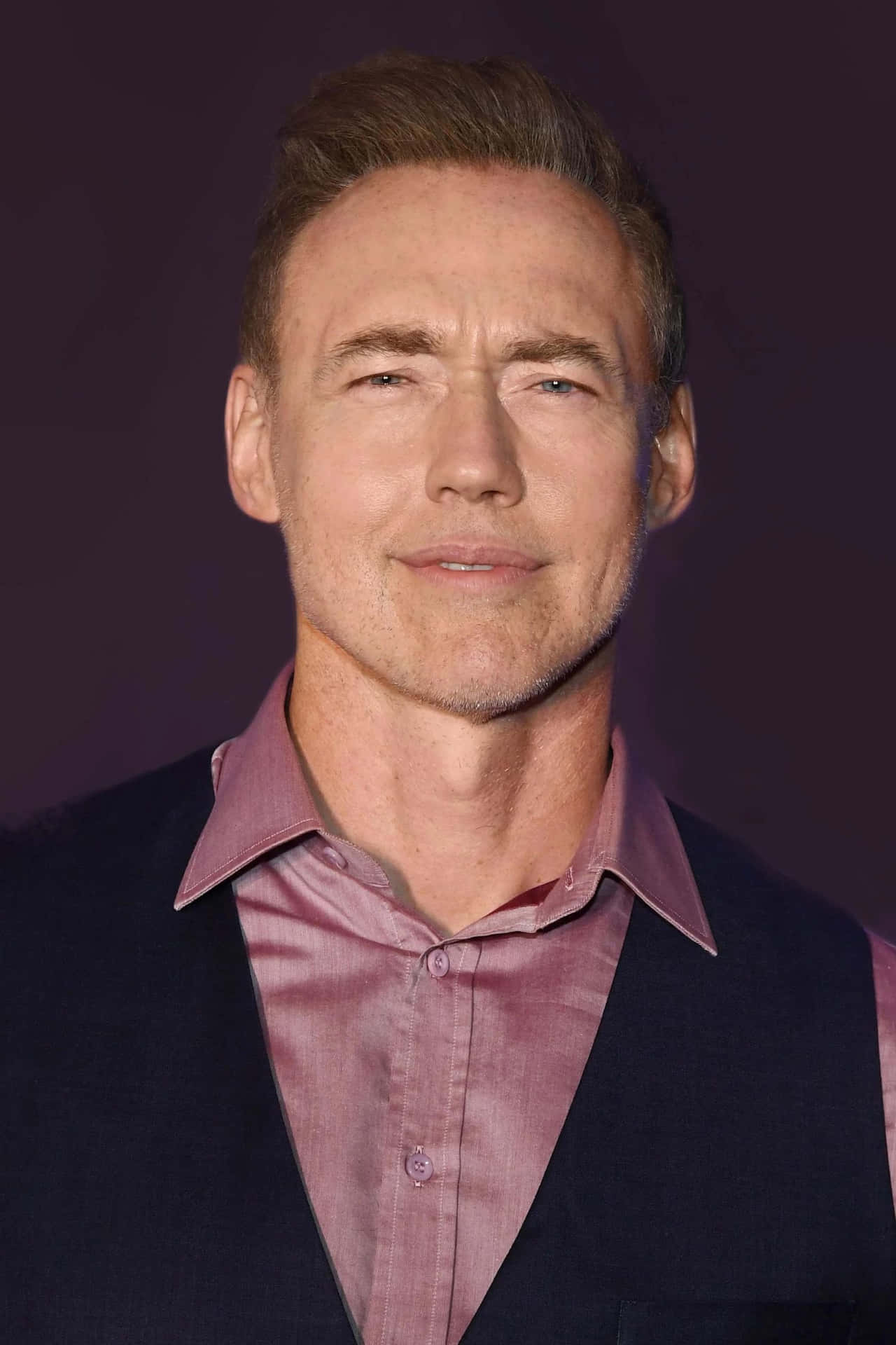 Actor Kevin Durand Looks Determined While Attending A Press Conference. Background
