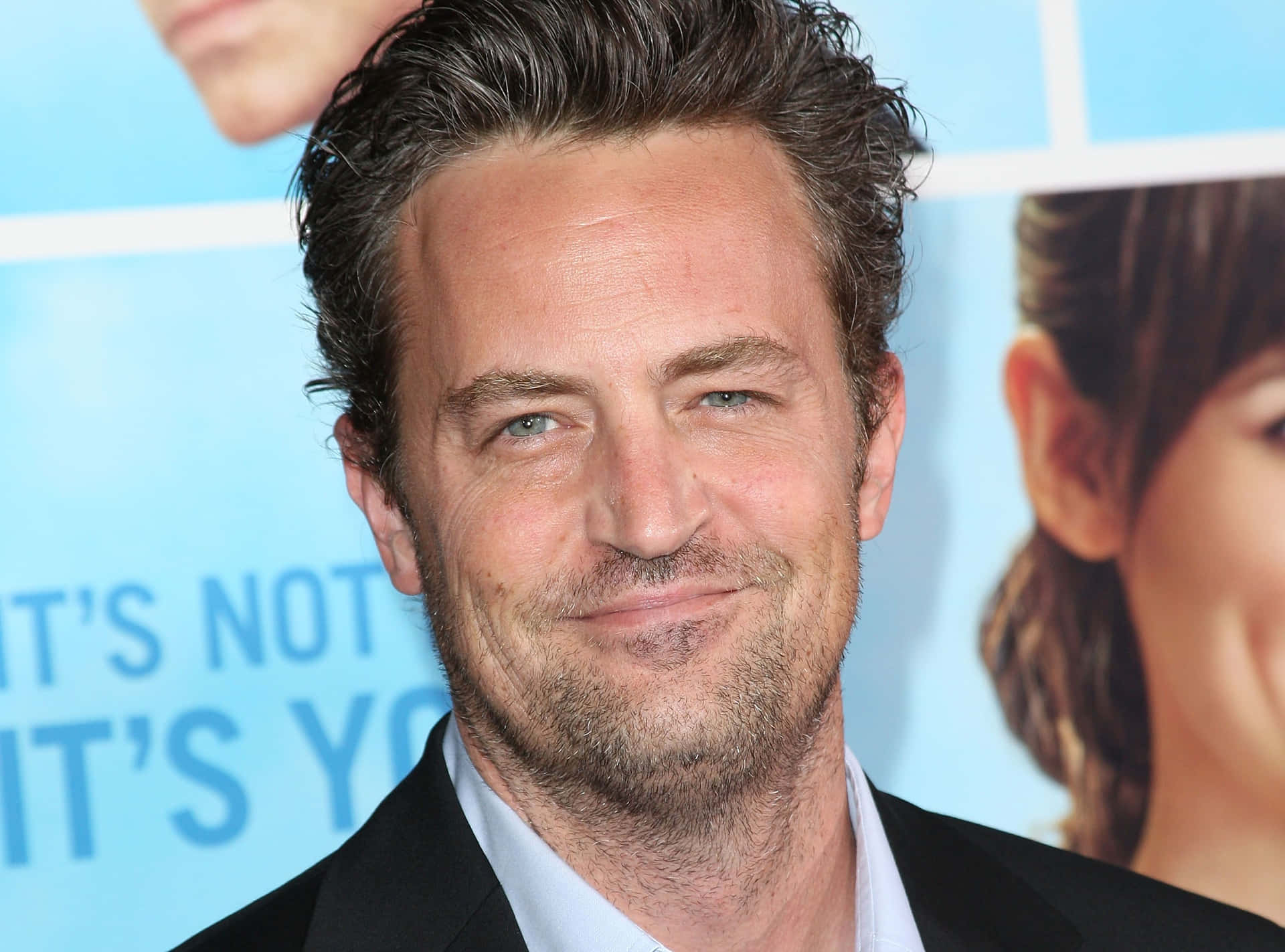 Actor Matthew Perry Looking Towards The Camera Background