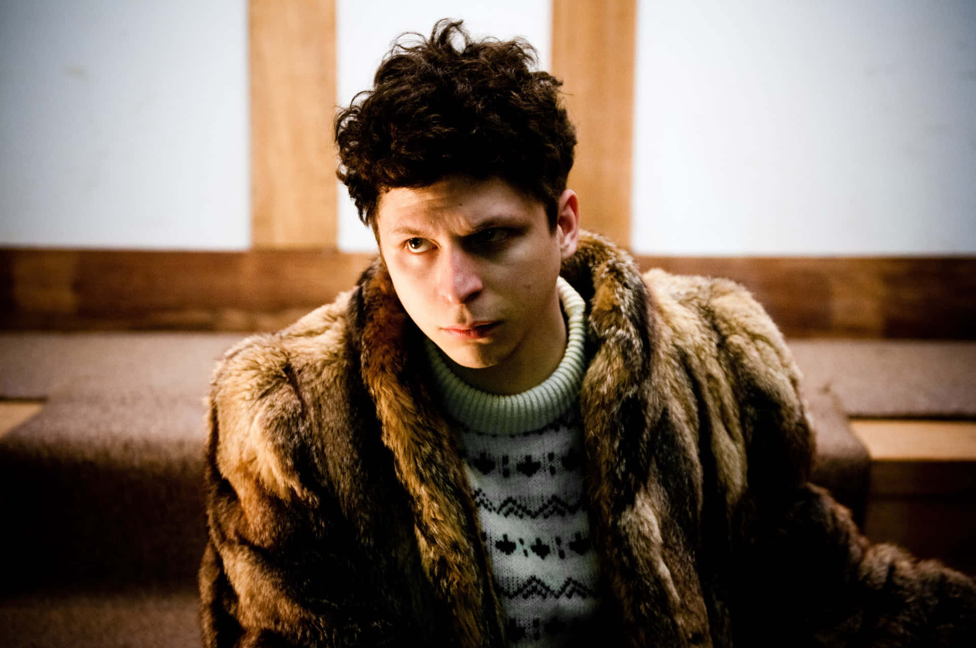 Actor Michael Cera Sporting A Confident Look With Casual Streetwear Background