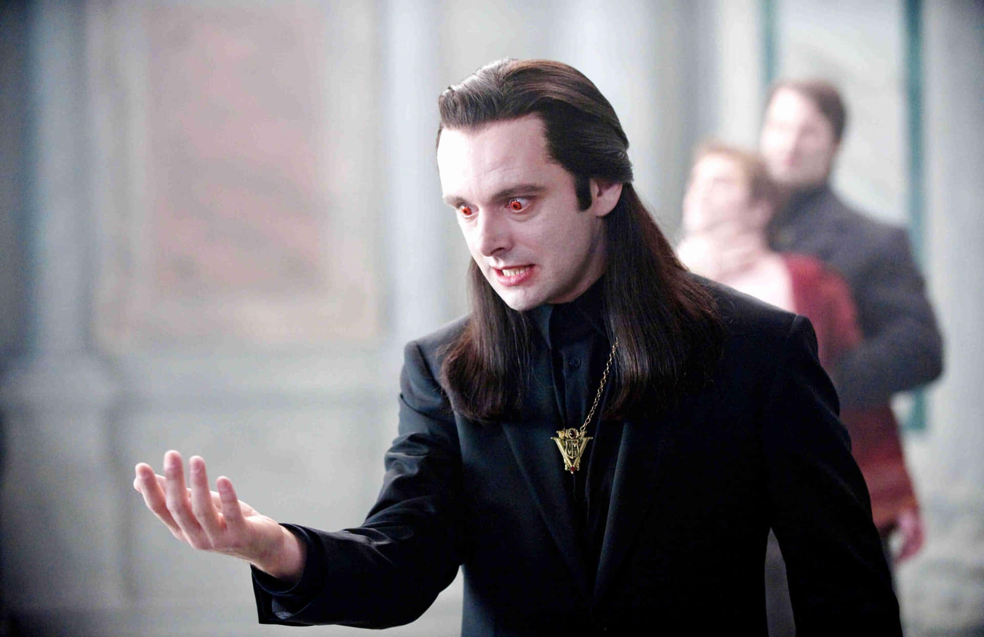 Actor Michael Sheen Looks Serious And Intense In This Screen Capture. Background