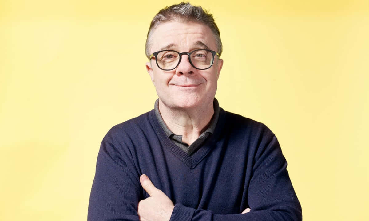 Actor Nathan Lane Chewing On A Cigar Background