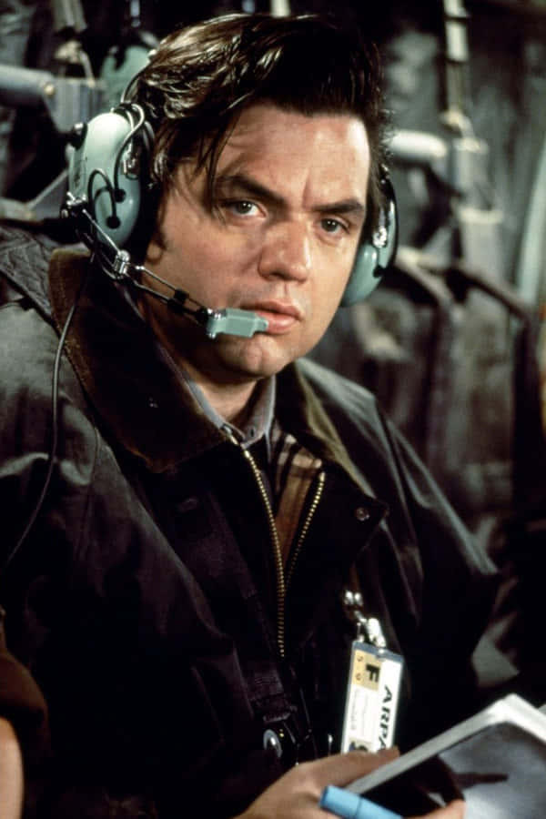 Actor Oliver Platt Staring Intently Background