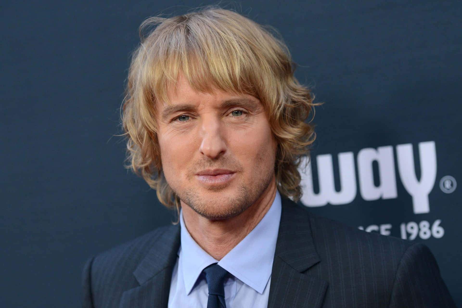 Actor Owen Wilson Poses For A Photo Background