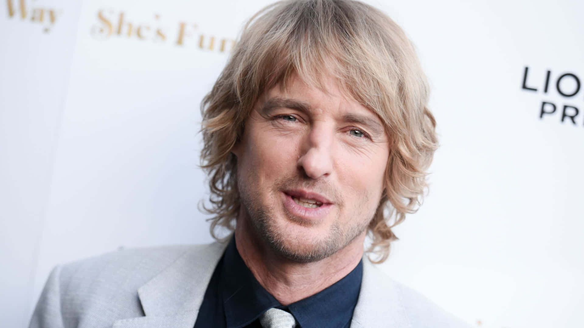 Actor Owen Wilson Smiling Background