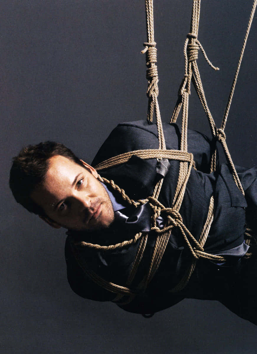 Actor Peter Sarsgaard Looking Intensely Into The Distance