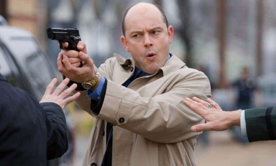 Actor Rob Corddry Looking Sharp In A Dark Suit. Background
