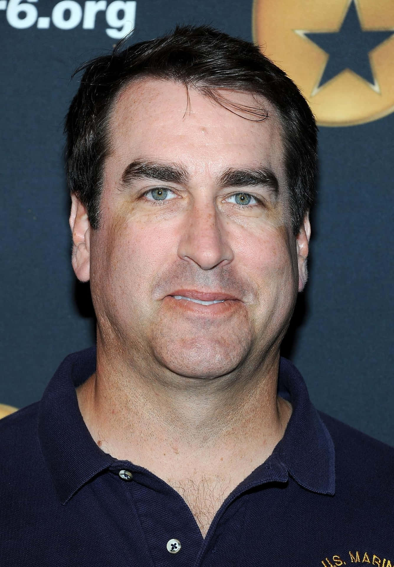Actor Rob Riggle As He Looks Off Into The Horizon Background