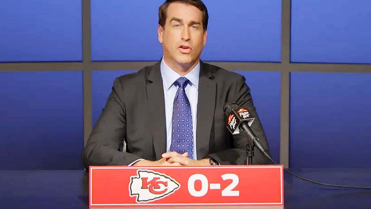 Actor Rob Riggle In A Candid Photograph Background