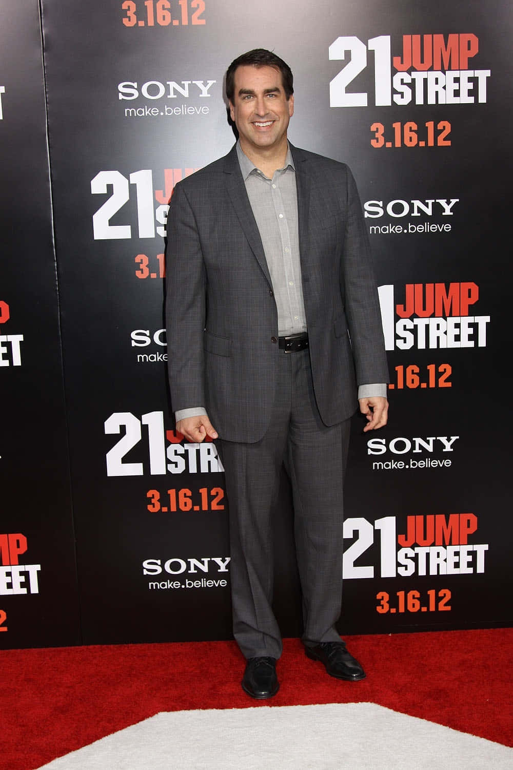 Actor Rob Riggle Sports A Humorous Expression In This Image Background