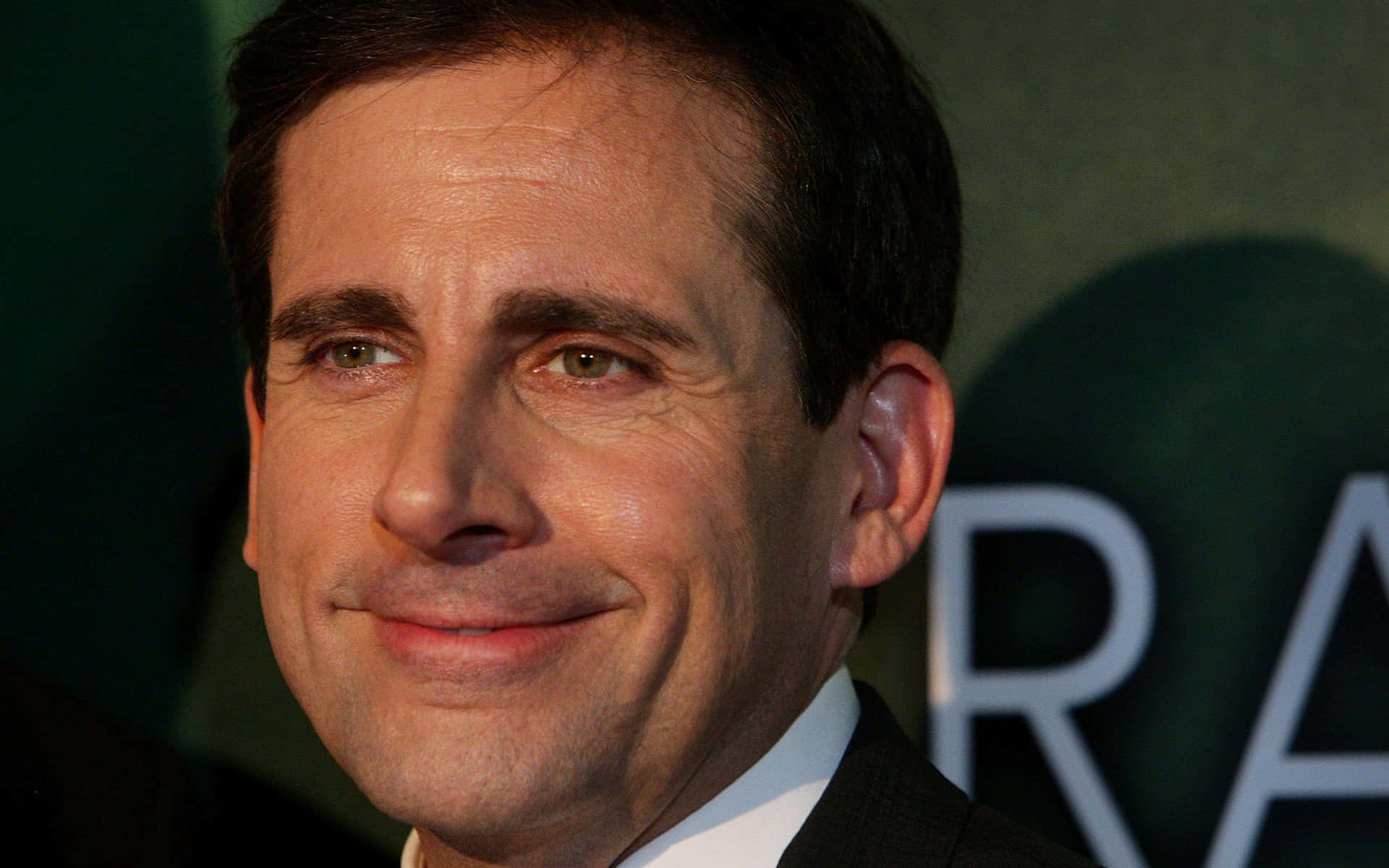 Actor Steve Carell With An Award Background