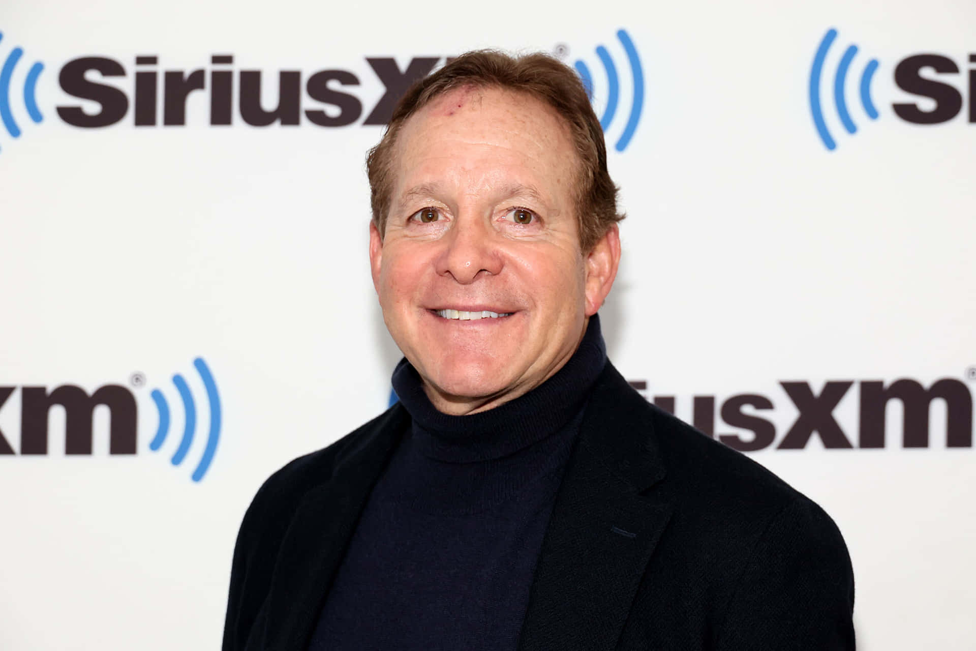 Actor Steve Guttenberg At A Movie Premiere Background